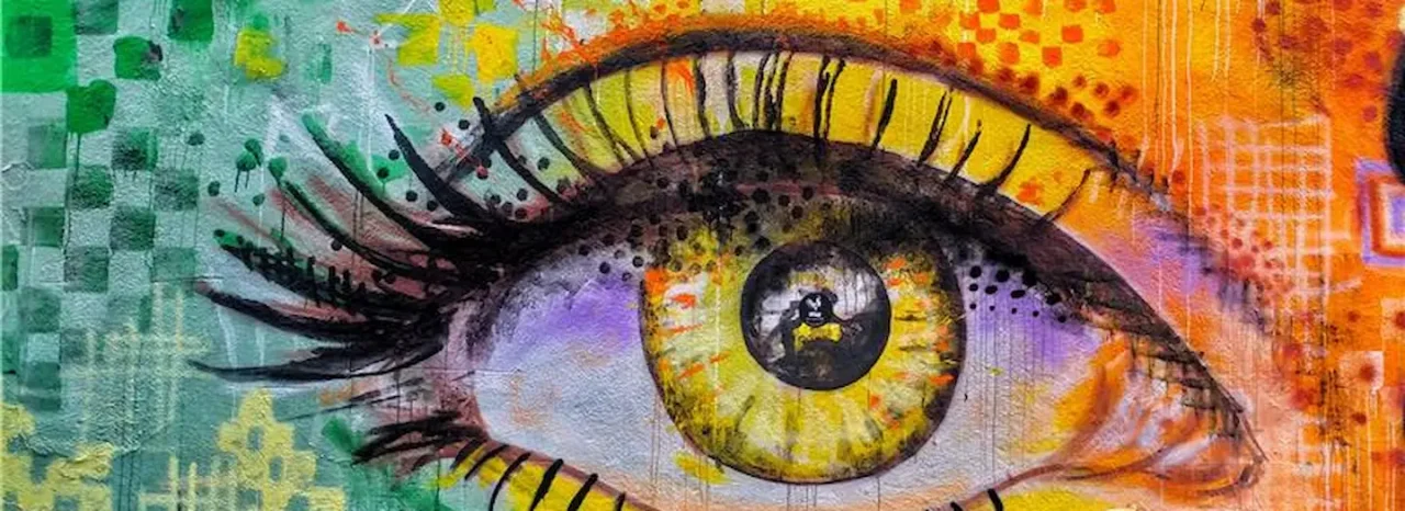 A graffiti mural of a stylised eye representing the Envision course offered by All Nations.