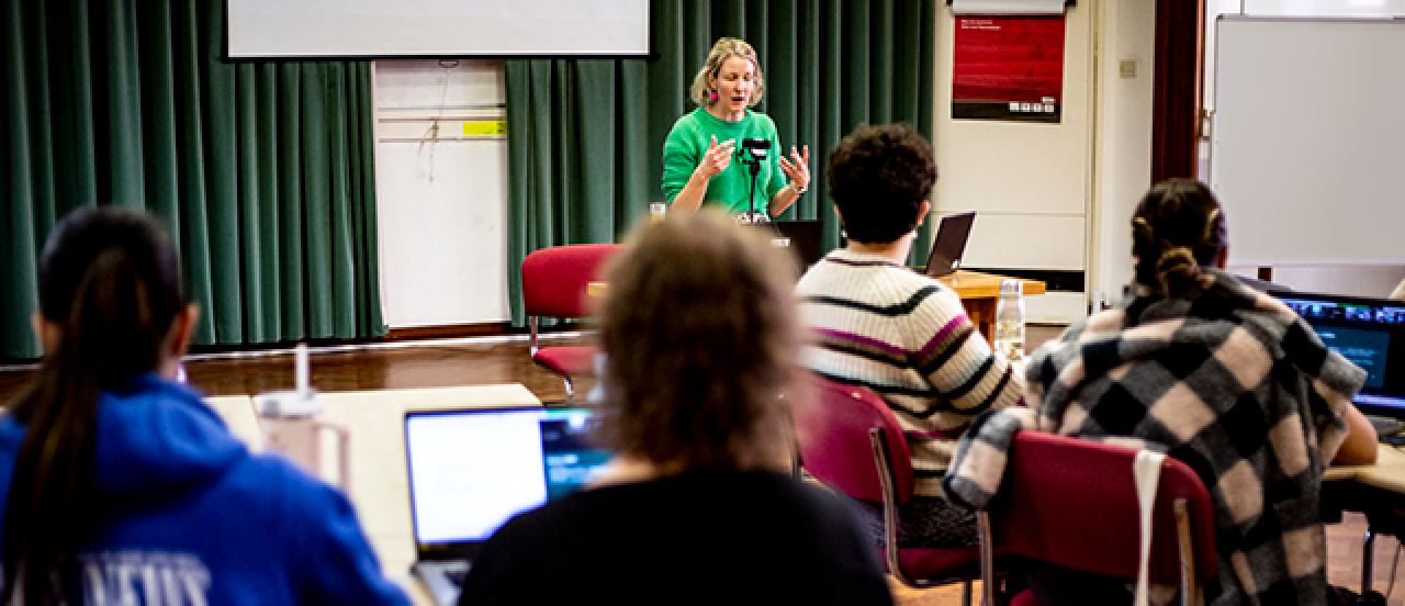 Lecture being delivered to a group of students.
