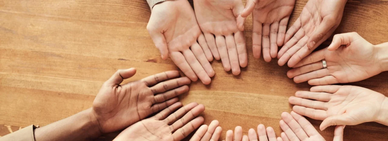 A series of open hands like in service, of different ethnicities, representing All Nations' partnerships with mission organisations around the world.
